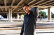 © Syda Productions - fitness, sport and healthy lifestyle concept - man stretching neck under bridge