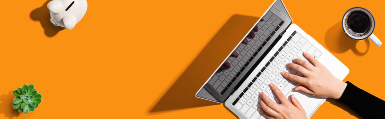 Poster - person using a laptop computer from above