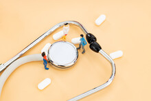 Small People Around The Medicine Capsule Stethoscope To Discuss Countermeasures