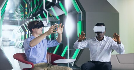 Poster - Composition of two businessmen sitting in modern lobby wearing vr headsets