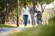 asian family enjoying outdoor activity in city park