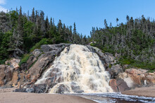 Beautiful Panorama Of The Grand-Sault Waterfall Flowing Into The Saint-Lawrence River In La Minganie, Quebec, Canada
