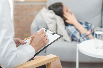 Wall Mural - psychologist talking with depressed patient about mental condition.