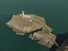 Beautiful View Of The South Stack Lighthouse And A Calm Sea