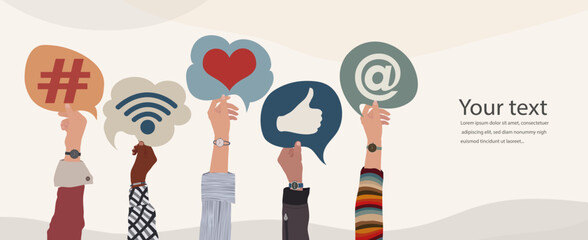 Wall Mural - Group of raised hands of diverse culture of people holding speech bubble with social media signs and symbols. Concept sharing friendship exchange community communication on social media