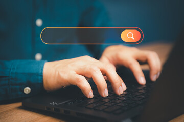 Poster - Freelance's hand working with computer laptop on desk in home. Searching Browsing Internet Data Information with blank search bar. Search Engine Optimization SEO Networking Concept.