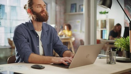 Aufkleber - Positive Project Manager Sitting at a Desk, Working on a Laptop Computer in an Office. Creative Handsome Marketing Specialist Planning a Project, Thinking About Motivational Ideas for a Startup.