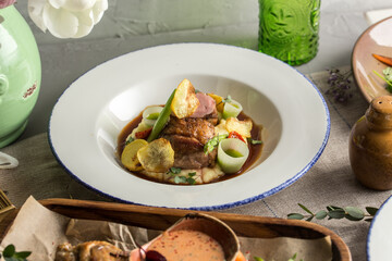 Wall Mural - Roasted duck with mashed potatoes on white plate on the table