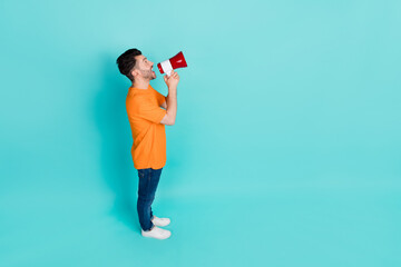 Canvas Print - Top high angle full length photo of positive man look empty space announce good news black friday sales isolated on cyan color background