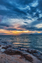 Sunset At A Beach Near Pattaya, Thailand, During The Monsoon (rainy) Season, When The Skies Can Produce Dramatic Colors And Cloudscapes
