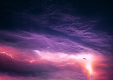 Bright Lightning On Purple Night Sky During Thunderstorm. Multiple Lightning Strikes Coming From Thunderstorm. Fantasy Abstract Landscape. Concept On Topic Weather, Cataclysms Hurricane, Tornado Storm