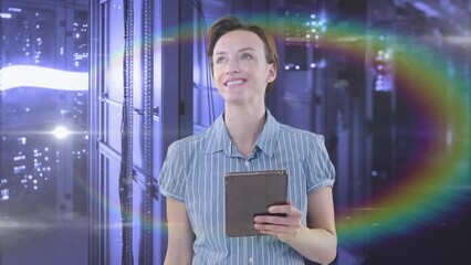 Poster - Animation of happy caucasian woman using tablet over lights and data processing on computer servers