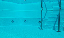Underwater View Of Swimming Pool With Stairs.
