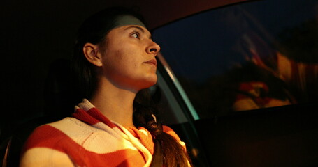 Wall Mural - Woman driving waiting red light traffic at night