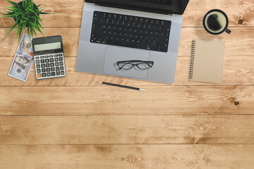 Fototapete - Flat lay of top view desk account financial money finance work table with computer notebook and pencil work space on little blur wood background includes copyspace for add text or graphic