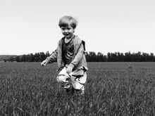 Child Running Across The Field Bnw Closeup