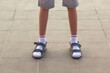 Legs in socks and sandals