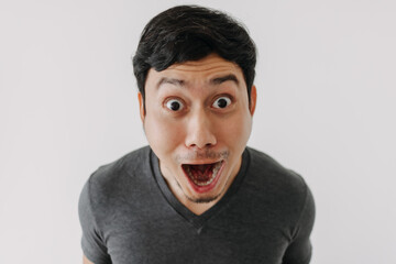 Wall Mural - Funny surprised shocked asian man face for promotion isolated on background.