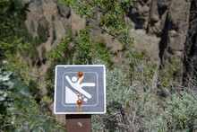 Warning Sign Of Loose Rocks And Falling And Slipping Danger Along A Hiking Trail