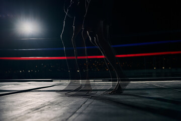 boxing ring, fitness legs and boxer man in a match, tournament or fight club. Prizefighter muscular person walking or ready for training in a dark arena for a competition or sports event with mockup