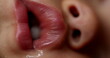 Baby lips macro close-up drooling sleeping. Toddler infant face detail closeup lips drool