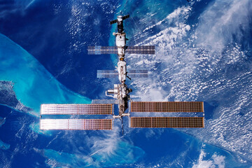 Wall Mural - international space station over the planet. elements of this image furnished by nasa
