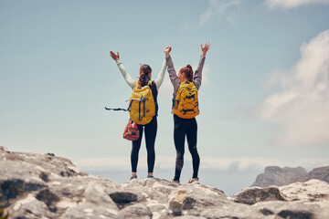 Hiking success, mountains travel and friends in celebration of fitness adventure, freedom in nature and cardio exercise on mountain in Switzerland. Women celebration of climbing cliff on holiday