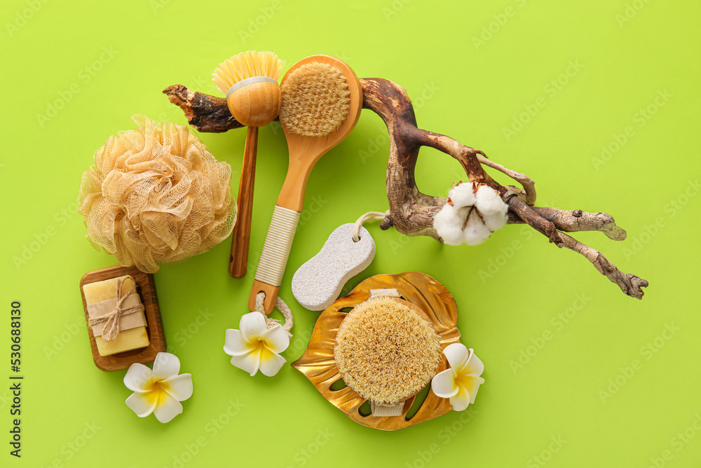 Beautiful composition with bath supplies on green background