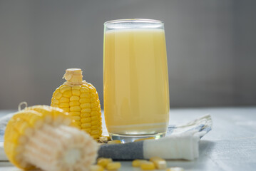 Wall Mural - Yellow Sweet corn drink on wood  background , Yellow Corn juice, sweet corn milk, healthy organic food, bio nutrition