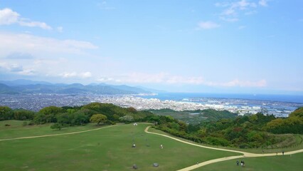 Poster - Garden and blue sky. distant view of the city