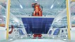 © IM Imagery - Orange Industrial Robot Arm Grabs and Moves Solar Panels on Conveyor. Automated Manufacturing Facilit. Production Line at Modern Bright Factory.