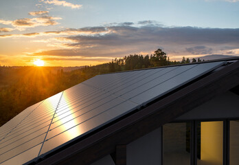 Wall Mural - photovoltaic panels on the roof of a modern house in the mountains