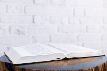 Wall Mural - The book is on the table. Open Holy Bible. Decorative wooden table.