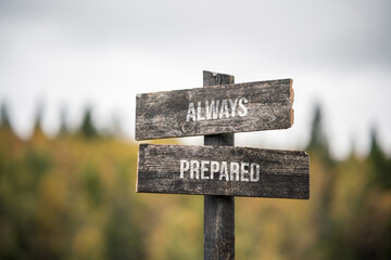 vintage and rustic wooden signpost with the weathered text quote always prepared, outdoors in nature