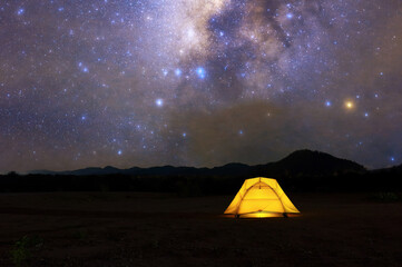Wall Mural - yellow tent under milky way galaxy lampang thailand, universe galaxy milky way time lapse, dark milk