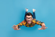 Full Length Photo Of Satisfied Glad Person Toothy Smile Fall Flying Isolated On Blue Color Background