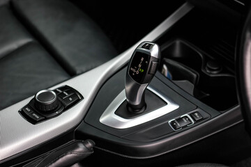 automatic transmission shift selector in the car interior. Closeup a manual shift of modern car gear shifter. 4x4 gear shift	