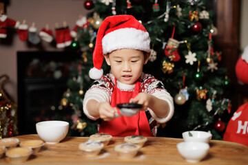 Wall Mural - young girl preparing mince pie for celebrating  Christmas party