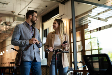 Wall Mural - Business people in office talking. Beautiful businesswoman talking with colleagues..