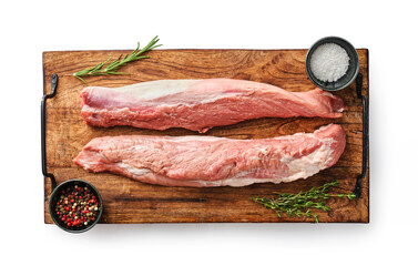 Wall Mural - Raw meat pork tenderloin on  wooden cutting board ready to cook. Seasonings for pork tenderloin thyme, pepper, salt.