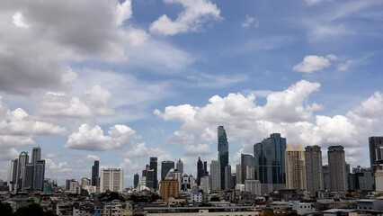 Wall Mural - time-lapse of beautiful blue sky with white cumulus on cityscape