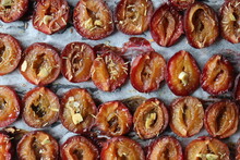 Plum Dried In The Oven With Spices And Garlic For Harvesting For The Winter In Jars Delicacy