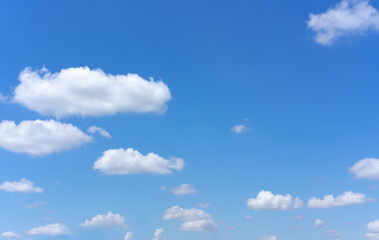 Wall Mural - clear blue sky background with white clouds