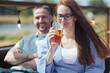 © Zelma - a young happy couple is enjoying a hot summer day sitting on the terrace of a restaurant