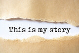 Fototapeta  - My story symbol. Words 'this is my story' appearing behind torn brown paper.
