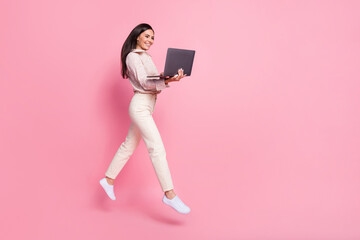 Sticker - Full length photo of lady manager jump using netbook searching discounts isolated on pastel color background