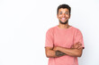 © luismolinero - Young handsome Brazilian man isolated on white background keeping the arms crossed in frontal position