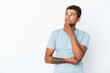 © luismolinero - Young handsome Brazilian man isolated on white background thinking an idea while looking up