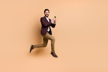 Sticker - Full body picture of businessman marketing manager chatting with colleagues in phone isolated on beige color background