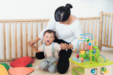 Dad Mother and daughter playing with toy at home. Happy Asian family girl kid playing with mom